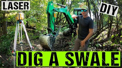 dig a swale with a mini excavator|how to dig swale trees.